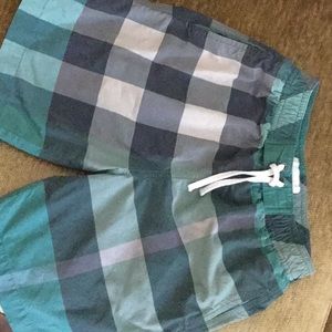 My son’s Burberry swim trunks